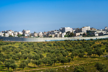 Israeli security fence near Jerusalem separating territory.