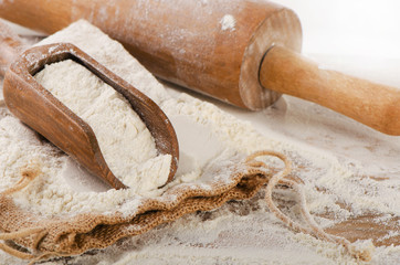 White Flour in a   wooden scoop.