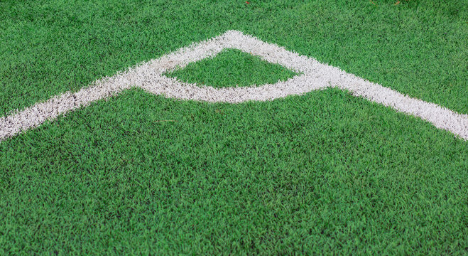 Green Grass texture of soccer or football field corner