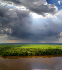 landscape with storm clouds and river