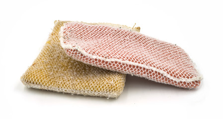 Old kitchen sponge on white background.