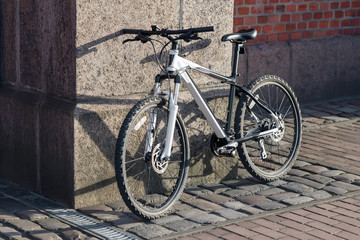 Fototapeta na wymiar bike near bricks wall