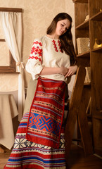 young woman in Slavic Belarusian national original suit studio