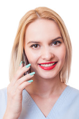 Smiling woman doctor using smartphone