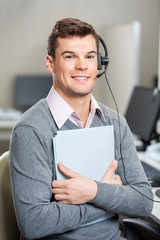 Young Customer Service Representative Holding File
