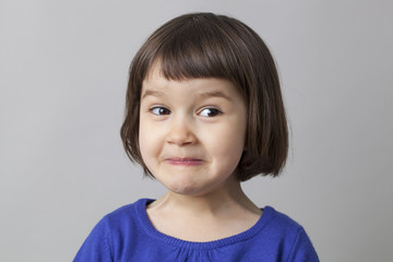 fun preschool girl making a face and enjoying humor © STUDIO GRAND WEB
