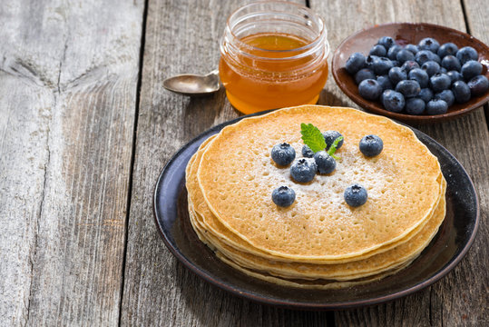 crepes with fresh blueberries and honey
