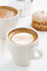 fresh espresso and cakes for breakfast, vertical