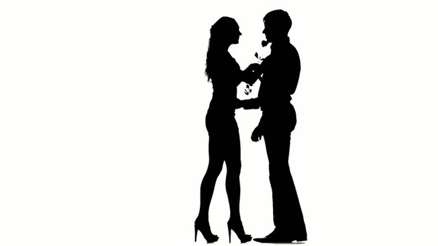 man with a rose waiting for his girl. Silhouette. Slow motion.