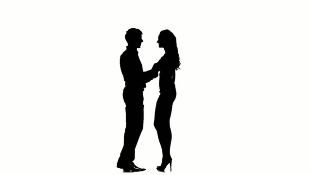 silhouette of two lovers. Isolated on white background. Slow