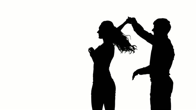 one couple man and woman dancing rock in studio silhouette