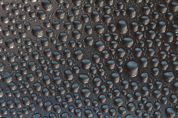 Water drops condensated on surface of a mineral water bottle