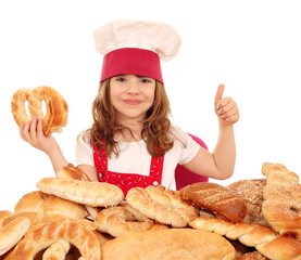 happy little girl cook with pretzel and thumb up