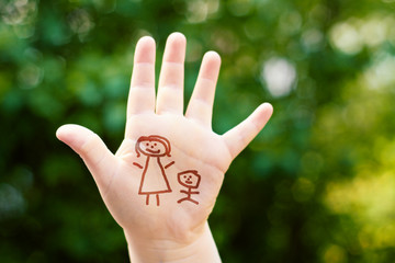 little girls hand with stickman mother and child - background 