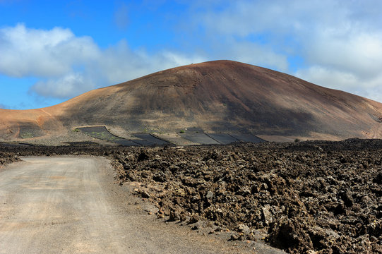 a road on volcanic landscape at  Lanzarote Island, Canary Island
