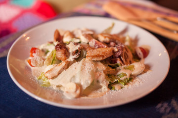 Caesar salad in a white plate