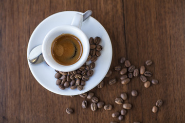 Aerial view of table with coffee cup and beans