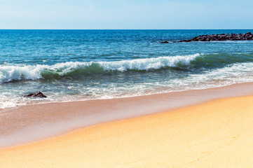 Soft wave of the sea on the sandy beach