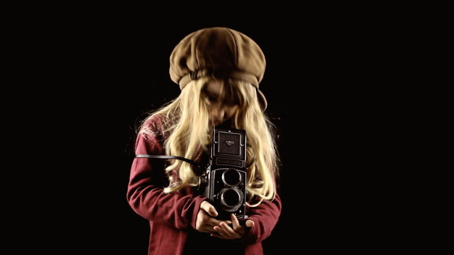 Little girl vintage paparazzi shooting pictures