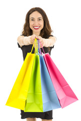 Fototapeta na wymiar Happy attractive shopping woman showing colorful shopping bags