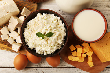 Tasty dairy products on wooden table close up
