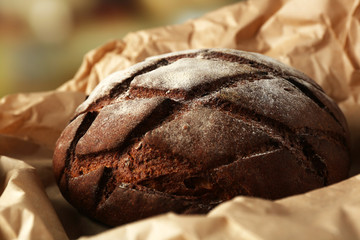 Fresh bread on paper close up