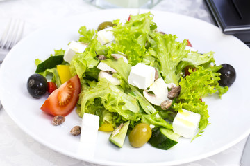 Greek salad on a table in a restaurant
