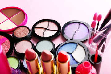 Set of decorative cosmetics on light colorful background