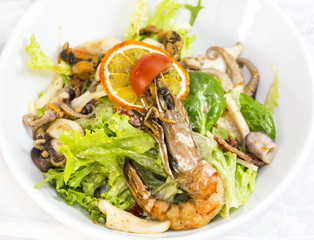 seafood salad on a plate on a white background