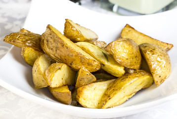 fried potatoes on a plate in a restaurant