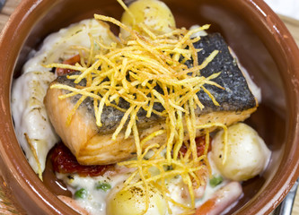 Baked salmon fillet with vegetables in a restaurant