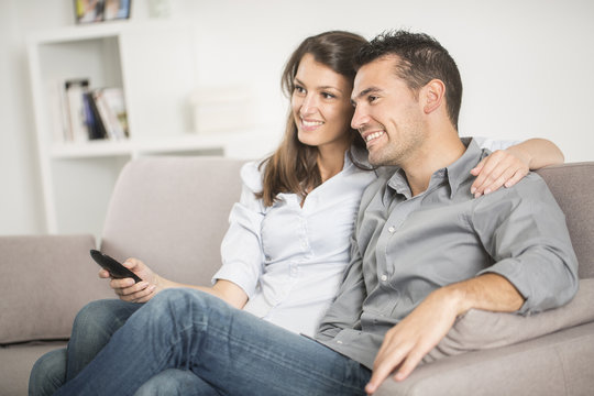 Young couple watcing tv