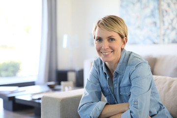 Portrait of middle-aged woman with short blond haircut