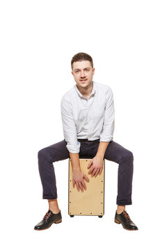 Guy playing the Cajon