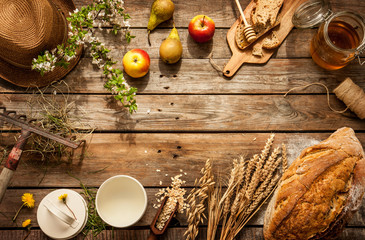 Natural local food products on vintage wooden table - rustic composition captured from above....