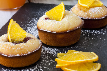Muffins with berries and oranges