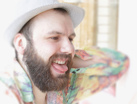 portrait of a bearded man smile leisure talking on the phone