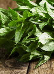 Fresh mint on an old wooden table, selective focus