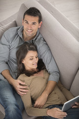 Happy couple using a tablet