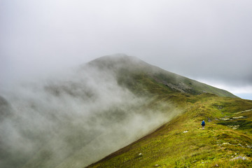 Mountain hiker  in clouds