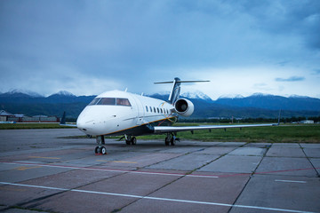 Business jet airplane on the ground. Early morning.