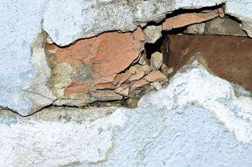 destroyed brick and concrete wall