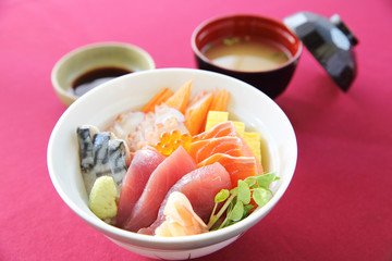 Sushi don , raw salmon tuna octopus on rice