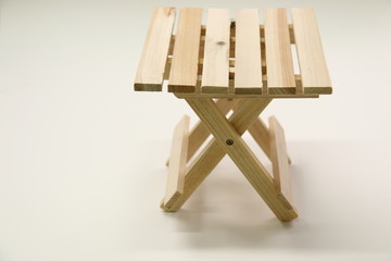 Wooden folding stool  on white background.