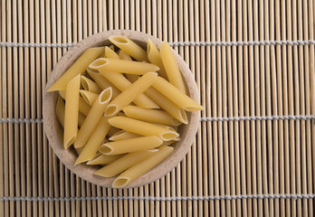 raw pasta called penne