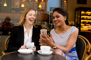 happy ladies enjoying a coffee