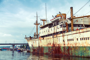 Old abandoned rusted ship stands moored in Varna