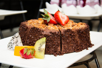 Fototapeta na wymiar Chocolate cakes with strawberry and kiwi