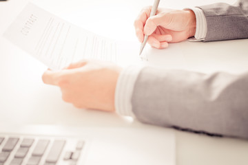 Business man signing a contract