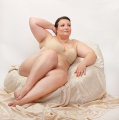 Overweight woman in the bedroom.